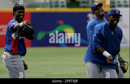 Dominican Republic's Jose Reyes, left, celebrates with teammate Nelson Cruz  their 9-0 victory over Panama at a World Baseball Classic game in San Juan,  Sunday, March 8, 2009. (AP Photo/Fernando Llano Stock