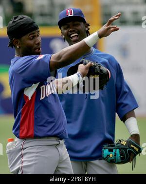 Dominican Republic's Jose Reyes, left, celebrates with teammate Nelson Cruz  their 9-0 victory over Panama at a World Baseball Classic game in San Juan,  Sunday, March 8, 2009. (AP Photo/Fernando Llano Stock