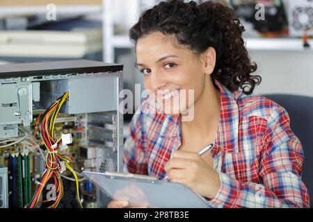 brunette happy woman pc engineer Stock Photo