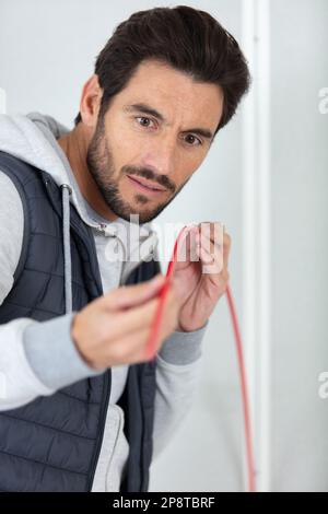 electrician engineer tests electrical installations Stock Photo