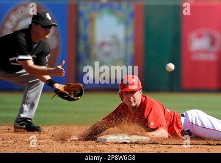 Colorado Rockies' Matt Holliday, right, gets a high-five from teammate  Jorge Piedra after scoring a run on a hit by Brad Hawpe off Los Angeles  Angels pitcher John Lackey in the sixth