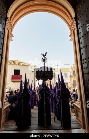 Arahal. Seville. Spain. 15th April, 2022. Insignia of an eagle on a laurel wreath. A moment of the penitential procession of the Brotherhood of Jesus Stock Photo