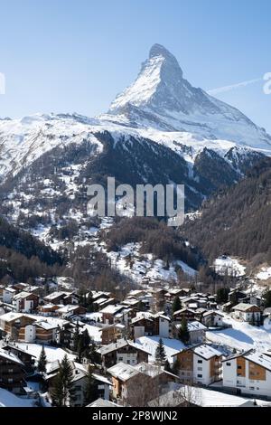 View of the Matterhorn from the hiking trail to Sunnegga, Switzerland, with the town of Zermatt below. Stock Photo