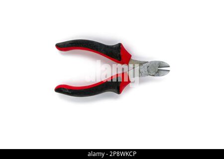Used wire cutters with red and black handles isolated on white background Stock Photo
