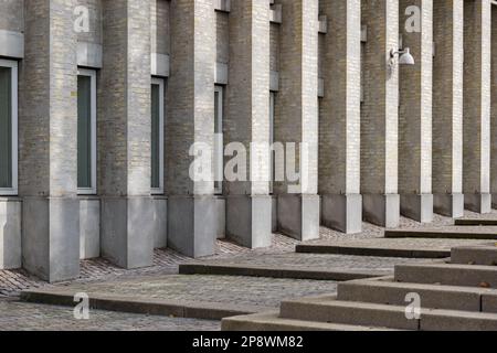 Outdoor exterior view of modern facade with vertical awning stripe pattern from columns and windows in Copenhagen, Denmark. Stock Photo