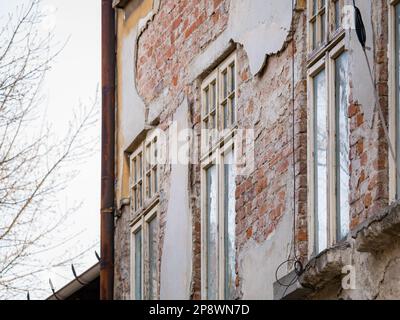 Detail with an old worn out building. Old vintage architecture in Bucharest, Romania. Stock Photo
