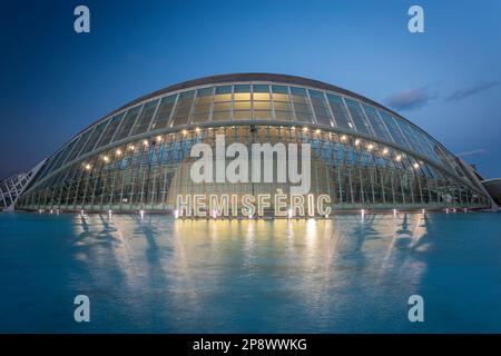 The Hemisfèric, also known as the planetarium or the 'eye of knowledge' reflected in water. Photo was taken on the 11th of February 2023 in the City o Stock Photo