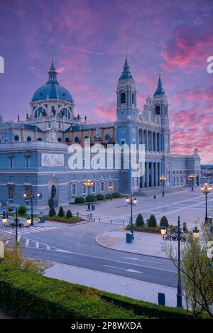 Madrid skyline with Santa Maria la Real de La Almudena Cathedral and the Royal Palace during sunset. Stock Photo