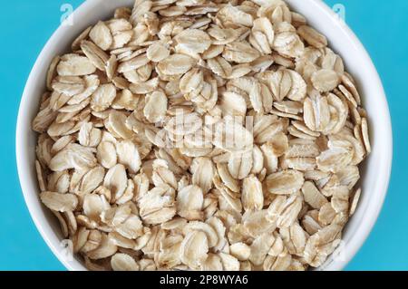 Close up picture of organic oat flakes in a bowl, selective focus. Stock Photo