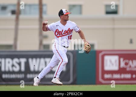 Baltimore Orioles' second baseman Adam Frazier (12) hits a ground ball into  a force play at second but makes it safely to first, driving in a run in  the bottom of the