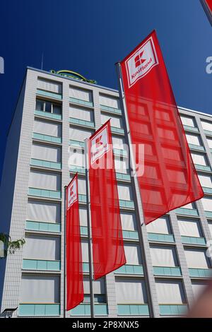 Cologne, Germany August 13 2022: flags of the supermarket kaufland in cologne ehrenfeld in front of the former building of the 4711 perfume factory Stock Photo