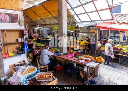 Kutaisi, Georgia, 04.06.21. Kutaisi Central Market (Green Bazaar,  Mtsvane Bazari) hall with market stalls with local fruits and vegetables, vendors. Stock Photo