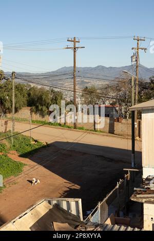 Ensenada, Baja California, Mexico - Side street in a poorer district overlooking the city; vertical orientation Stock Photo