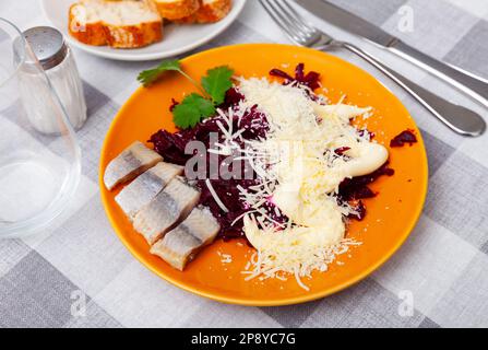 Beetroot served with cheese and pickled mackerel Stock Photo