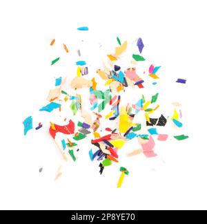 Colorful graphite crumbs on white background, top view. Pencil sharpening Stock Photo