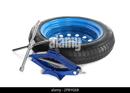 Car wheel, scissor jack and cross torque wrench on white background Stock Photo