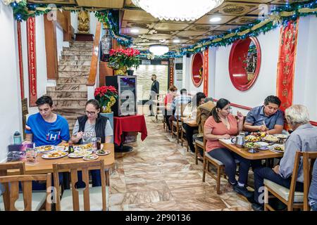 Mexico City,Barrio Chino Chinatown,sitting table man men male,woman women lady female,adult adults,resident residents,couple couples,senior seniors ci Stock Photo