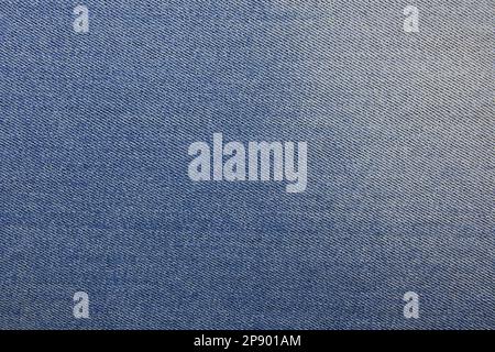 Blue jeans fabric background texture. Blue jeans fabric cloth textile material. Stock Photo