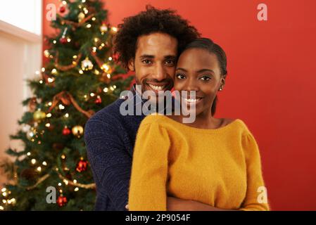 Festive love. Cropped portrait of a loving young couple on Christmas. Stock Photo