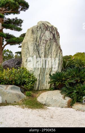 A huge rockery stone set in a japanese garden Stock Photo - Alamy