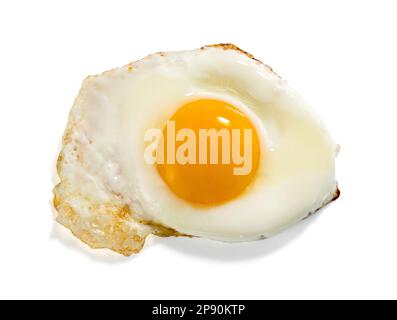 Top view of delicious homemade fried egg with orange yolk placed on white background Stock Photo