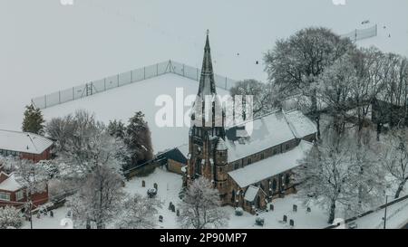 An aerial view of St Pauls church in the village of Monk Bretton in Barnsley as Yellow warning of snow is enforce in the Yorkshire area; Monk Bretton, Barnsley,  South Yorkshire, United Kingdom, 10th March 2023  (Photo by Mark Cosgrove/News Images) Stock Photo