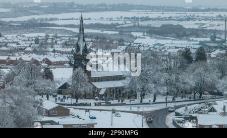 An aerial view of St Pauls church in the village of Monk Bretton in Barnsley as Yellow warning of snow is enforce in the Yorkshire area; Monk Bretton, Barnsley,  South Yorkshire, United Kingdom, 10th March 2023  (Photo by Mark Cosgrove/News Images) Stock Photo