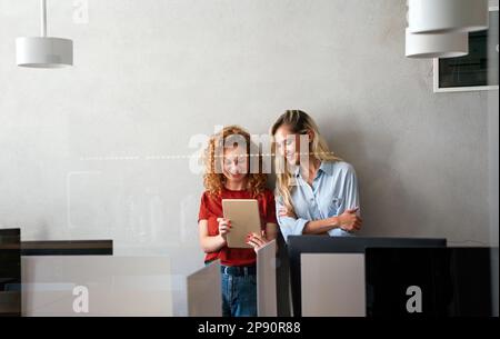 Happy successful young business colleagues working in office. Business people technology concept Stock Photo
