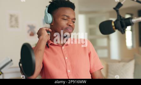 Podcast, speaking and recording conversation for interview. Communication, talking and discussion in studio with mic to broadcast for online streaming Stock Photo