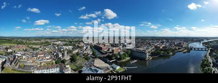 Aerial view of Limerick city center with Shannon river in the middle. Picture taken during a very sunny summer day. Stock Photo