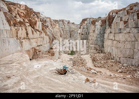 April 2, 2014, Afyonkarahisar, scehisar, Turkey: After the blocks are mined at the mine site, large and deep crevices are formed over time. The quarries at Iscehisar (ancient Dokimeion) in central Phrygia were a major source of white marble and a purple-streaked marble called pavonazzetto. The quarries were controlled by the Roman state but this does not mean that all of the marble quarried here was imperially controlled. White marble from these quarries was predominately used for sarcophagi and statuary locally, though these objects were sometimes exported. The pavonazzetto quarried at Iscehi Stock Photo
