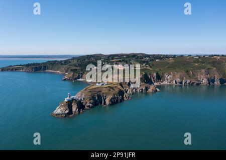 Howth, co. Dublin / Ireland - September 2020 : Aerial view of The Baily Lighthouse on Howth Head. Whole Howth peninsula visible in the frame. Stock Photo