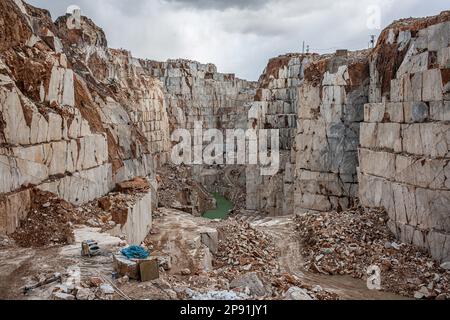 March 13, 2014, Afyonkarahisar, scehisar, Turkey: After the blocks are mined at the mine site, large and deep crevices are formed over time. The quarries at Iscehisar (ancient Dokimeion) in central Phrygia were a major source of white marble and a purple-streaked marble called pavonazzetto. The quarries were controlled by the Roman state but this does not mean that all of the marble quarried here was imperially controlled. White marble from these quarries was predominately used for sarcophagi and statuary locally, though these objects were sometimes exported. The pavonazzetto quarried at Isceh Stock Photo
