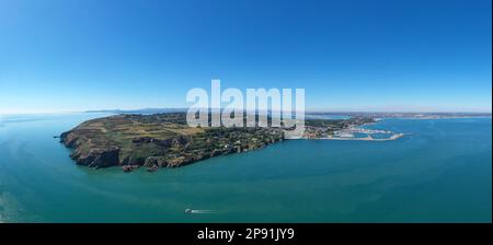 Howth, co. Dublin / Ireland - September 2020 : Aerial view of The Baily Lighthouse on Howth Head. Whole Howth peninsula visible in the frame. Stock Photo