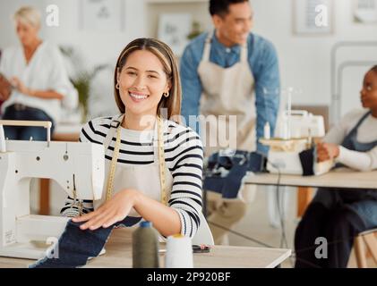 Fashion, design and style with a young designer working in a startup on a sewing machine in a workshop. Busy and creative designer creating new Stock Photo