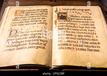 TURIN, ITALY - CIRCA MAY 2021: antique Medieval manuscript with ancient calligraphy Stock Photo