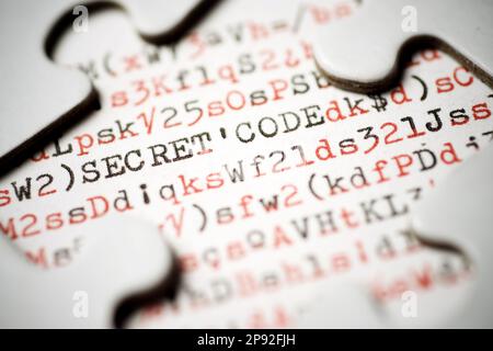 Secret code text written with a typewriter in a white puzzle Stock Photo