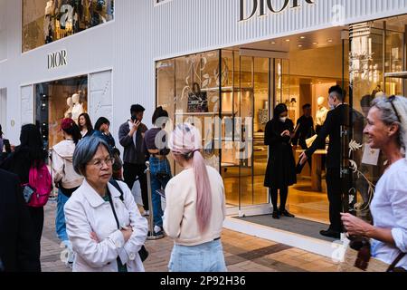 Hong Kong, China. 10th Mar, 2023. Shoppers queue in line to enter a luxury fashion brand Dior store in Tsim Sha Tsui shopping district. (Credit Image: © Keith Tsuji/ZUMA Press Wire) EDITORIAL USAGE ONLY! Not for Commercial USAGE! Stock Photo