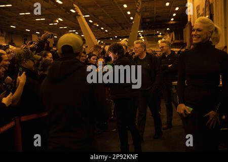 Tom Cruise, center, meets with Sailors of the Nimitz-class aircraft carrier USS George H.W. Bush (CVN 77), during a visit to the ship, on March 2, 2023, while filming scenes for 'Mission: Impossible - Dead Reckoning Part Two.' The George H.W. Bush Carrier Strike Group is on a scheduled deployment in the U.S. Naval Forces Europe area of operations, employed by U.S. Sixth Fleet to defend U.S., allied and partner interests. Photo by MC2 Novalee Manzella/U.S. Navy/UPI Stock Photo