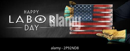 Happy Labor Day concept. Manual worker with protective work gloves holding a metal national flag of the United States of America, USA (American flag), Stock Photo