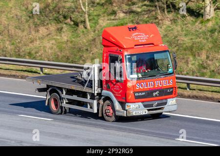 C & J NICHOLS COAL MERCHANTS, C. J. & J Nicholls provide coal and solid fuels to businesses and homes across the Fylde Coast. Solid Fuels.  2002 Red DAF LF FA LF45 150 45.150 SLP  3900cc Diesel Flatbed Truck; travelling on the M61 motorway, UK Stock Photo
