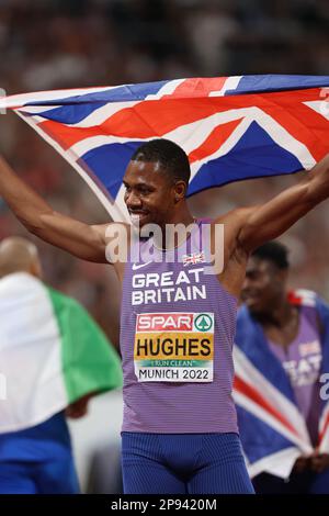 Zharnel HUGHES with the GB flag after finishing 2nd in the 100m Final at the European Athletics Championship 2022 Stock Photo