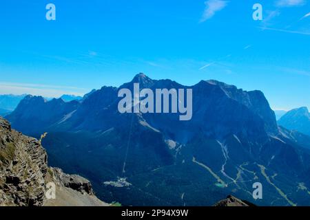 View from the summit of Daniel (2340m), highest peak of the Ammergau Alps, to the Wetterstein massif with from left Waxenstein, in the middle Zugspitze (2963m), on the right Schneefernerkopf, Lermoos, Zugspitzarena, Tirol, Austria Stock Photo