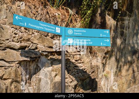 The city of Merano (South Tyrol, Italy) offers many gorgeous hiking trails that offers great views. These green signs can be found along the way. Stock Photo