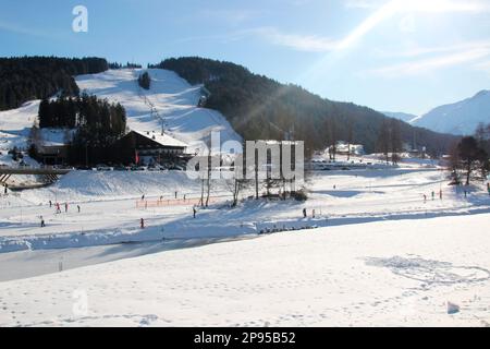 Austria, Tyrol, Seefeld, village view, winter mountain landscape, landmark, winter sports resort, Seefeld plateau, ski lift, cross-country ski trails, ski jumping facility Stock Photo