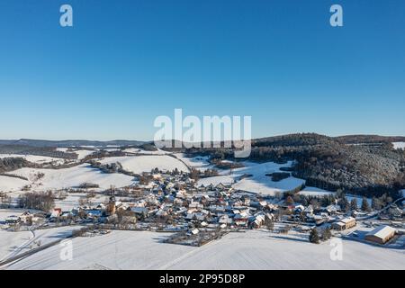 Germany, Thuringia, Allendorf, village, church, gardens, mountains, forest, snow, overview, aerial photo Stock Photo