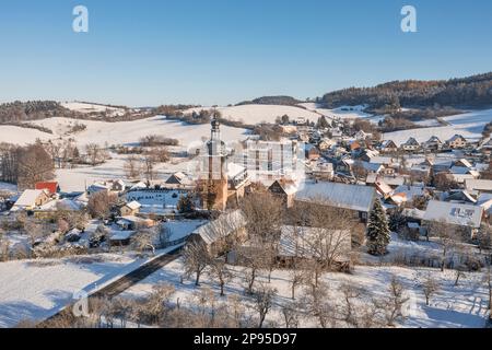 Germany, Thuringia, Allendorf, village, church, gardens, mountains, forest, snow, overview, aerial photo Stock Photo