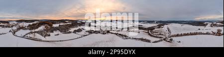 Germany, Thuringia, Allendorf, village, snow covered fields, forests, landscape, evening light, overview, aerial photo, partly back light, 36ö° panorama Stock Photo