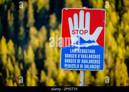 In the valley of Pfundser Tschey  (Tyrol, Austria) there are avalanche warning signs. These signs that warn of avalanches can be life-saving Stock Photo