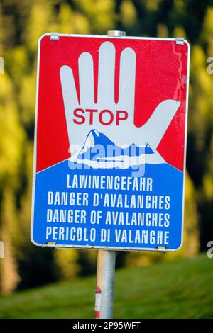 In the valley of Pfundser Tschey  (Tyrol, Austria) there are avalanche warning signs. These signs that warn of avalanches can be life-saving Stock Photo